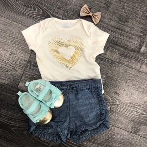 cream Onsie with Gold design and denim shorts